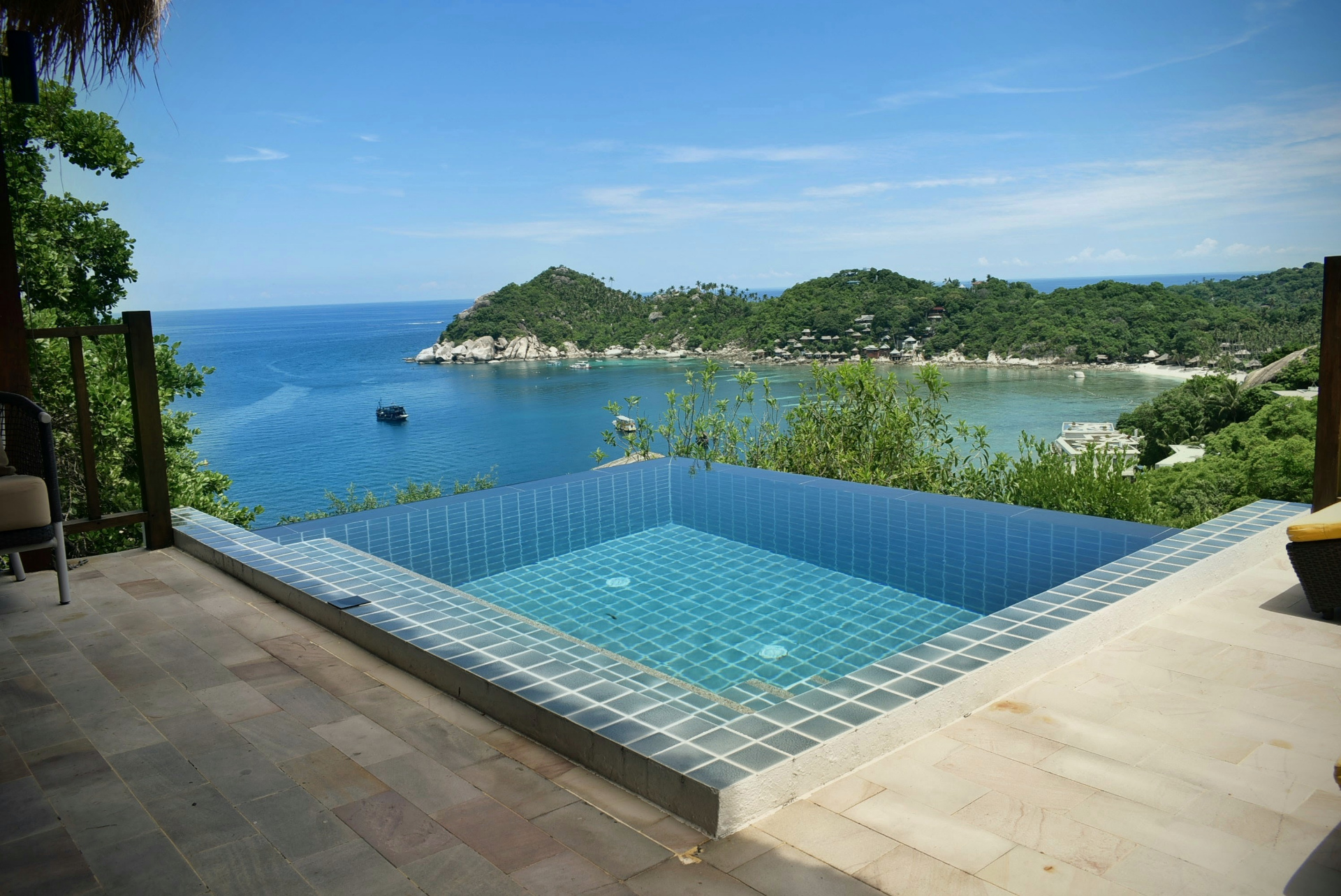 Infinity pool with blue mosaic tiles overlooking the bay at The Red Snapper House