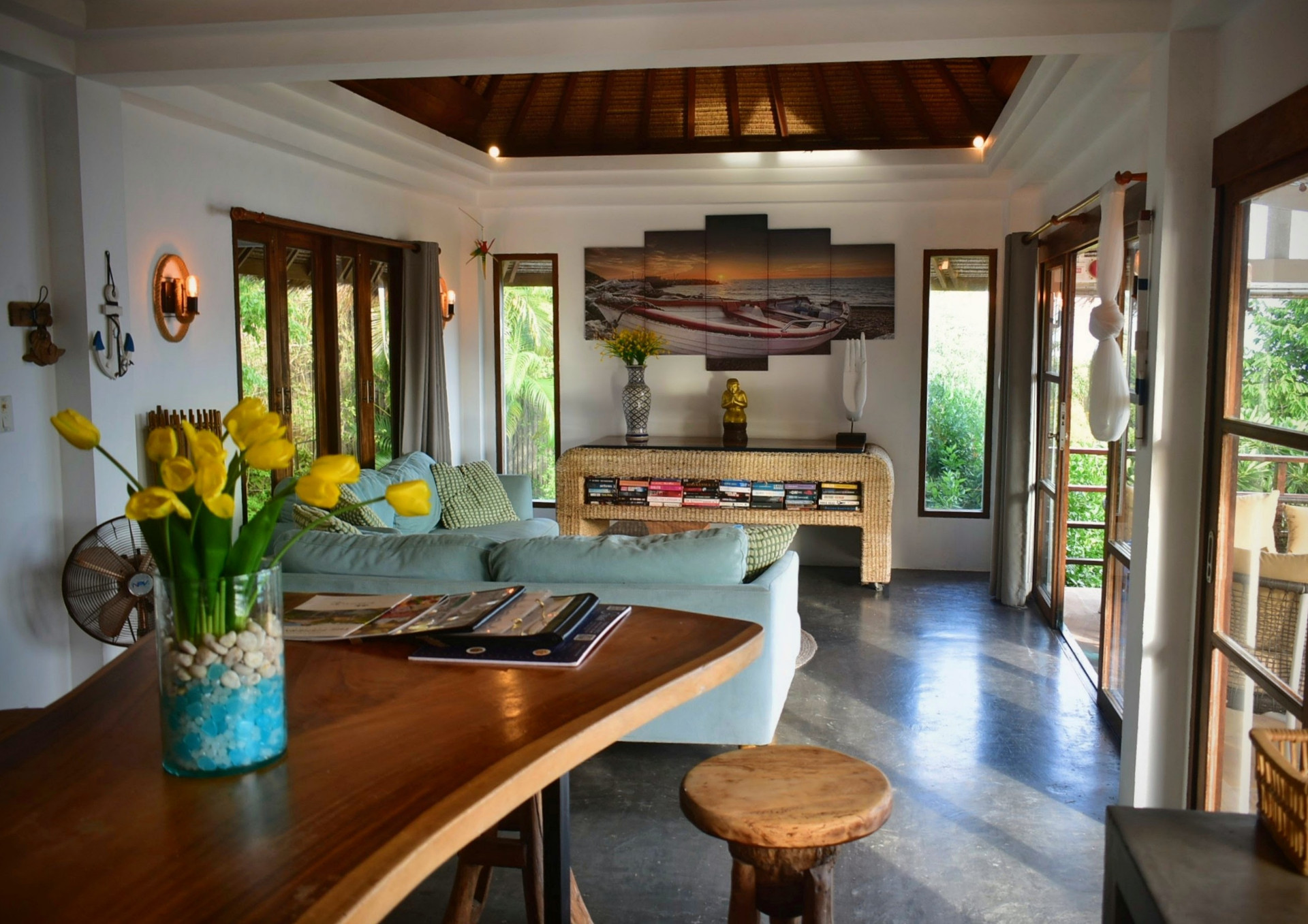 Living and dining area with sea-view artwork at The Fisherman’s House