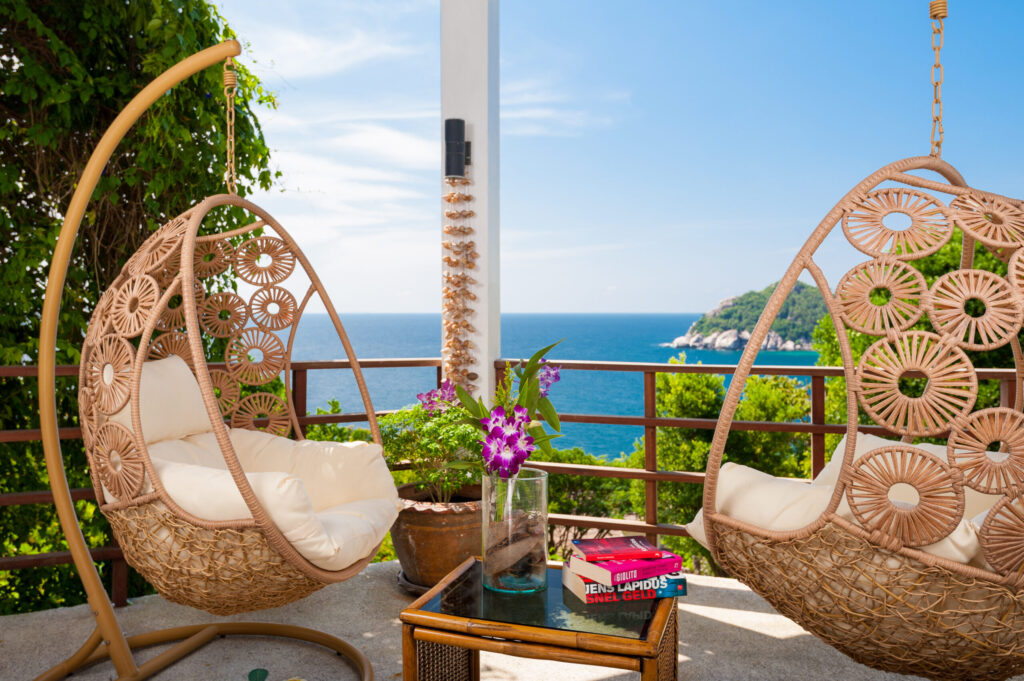 Woven swing chairs on the sea-view terrace at The Fisherman’s House