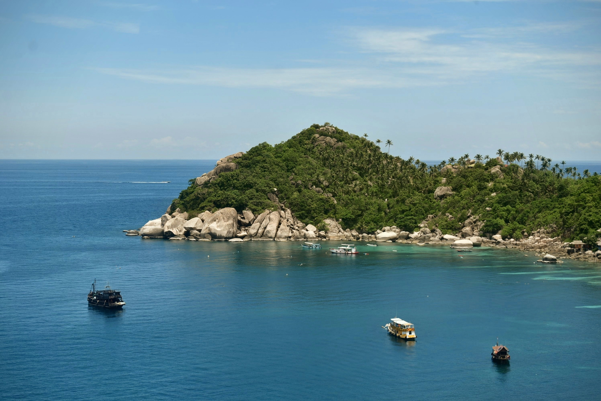 Aerial view of the bay and dive boats near The Red Snapper House