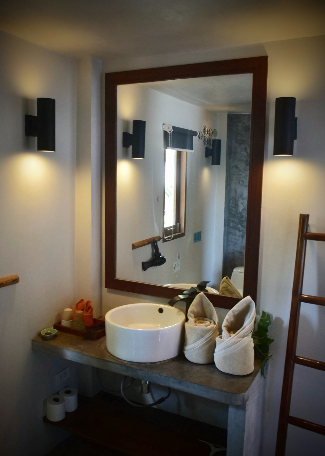 Bathroom with framed mirror and vessel sink at The Trevally House