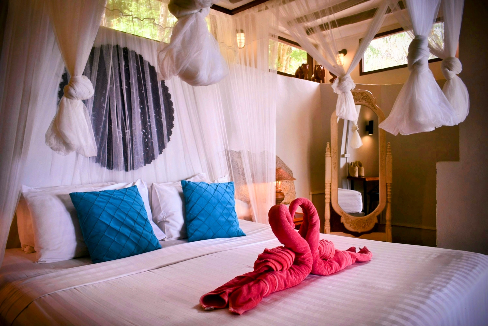 Canopy bed with mosquito nets and mirror in The Fisherman’s House