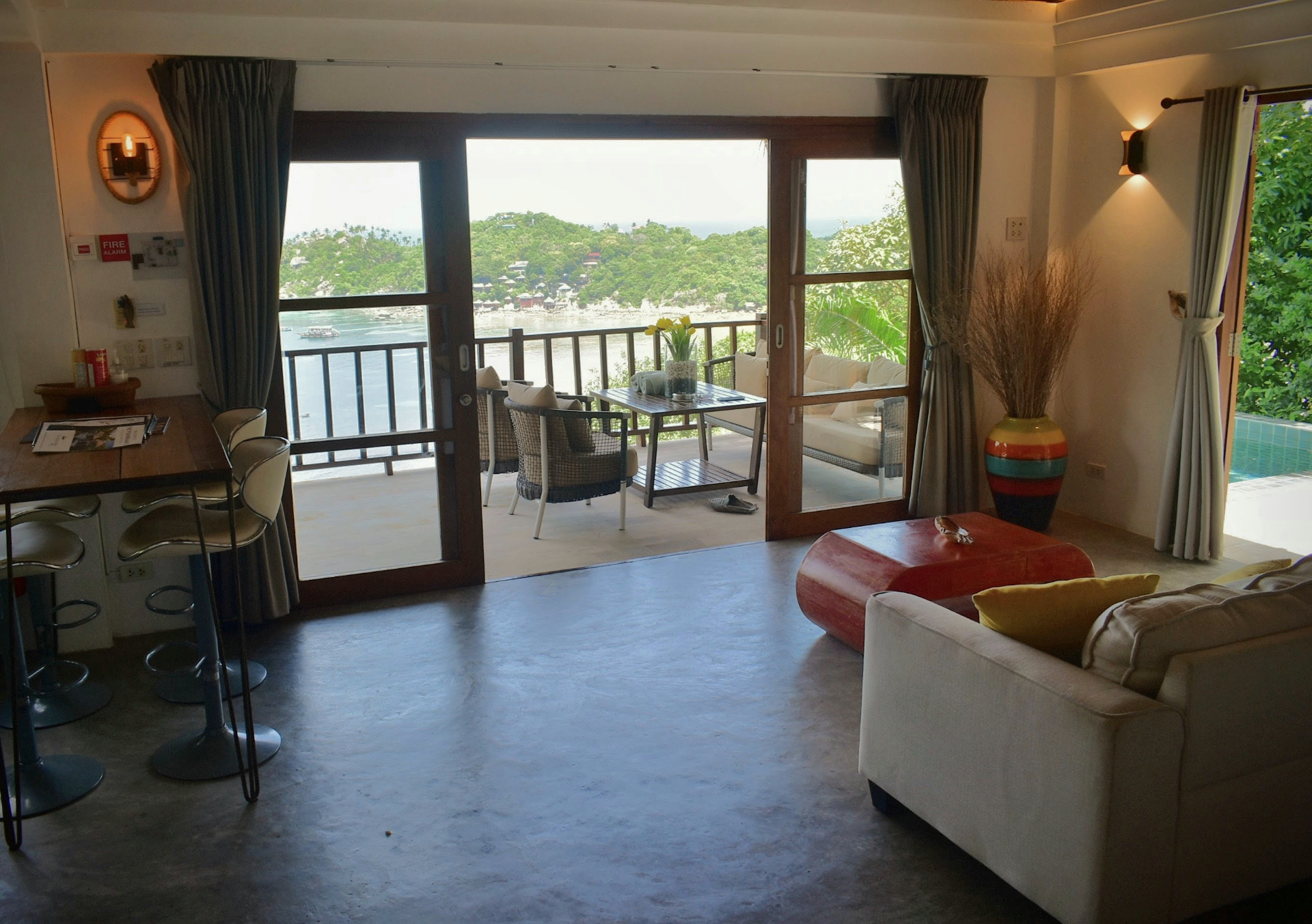 Open living space of The Trevally House opening onto the sea-view terrace