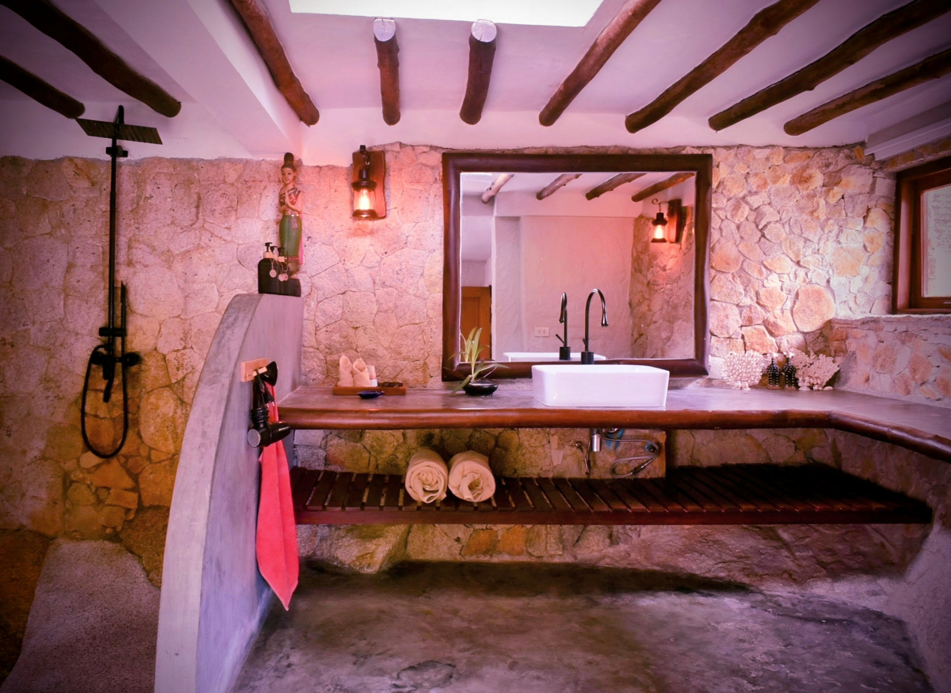 Stone bathroom with rain shower in The Fisherman’s House