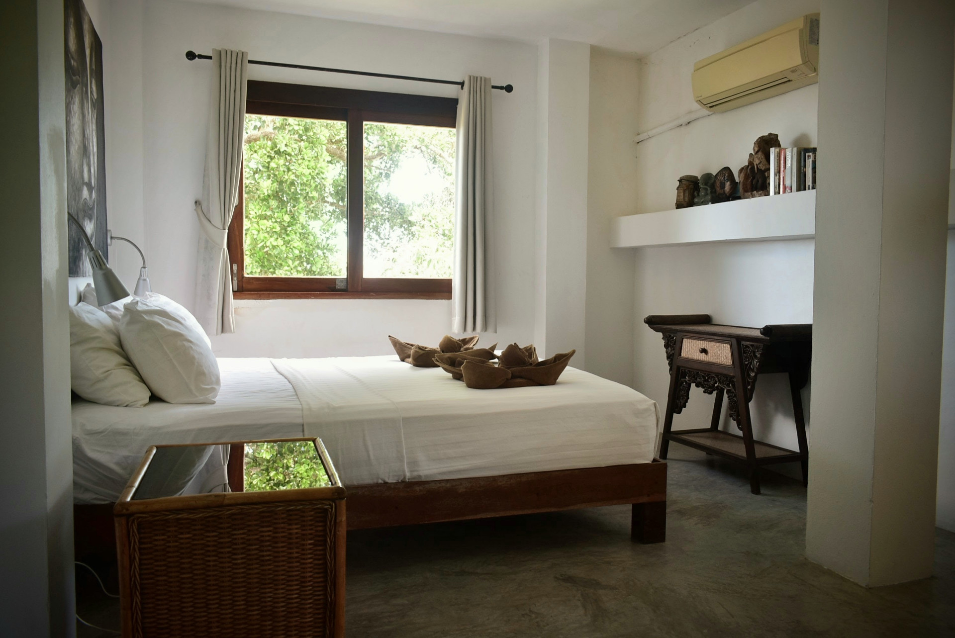 Bright bedroom with garden window at The Red Snapper House