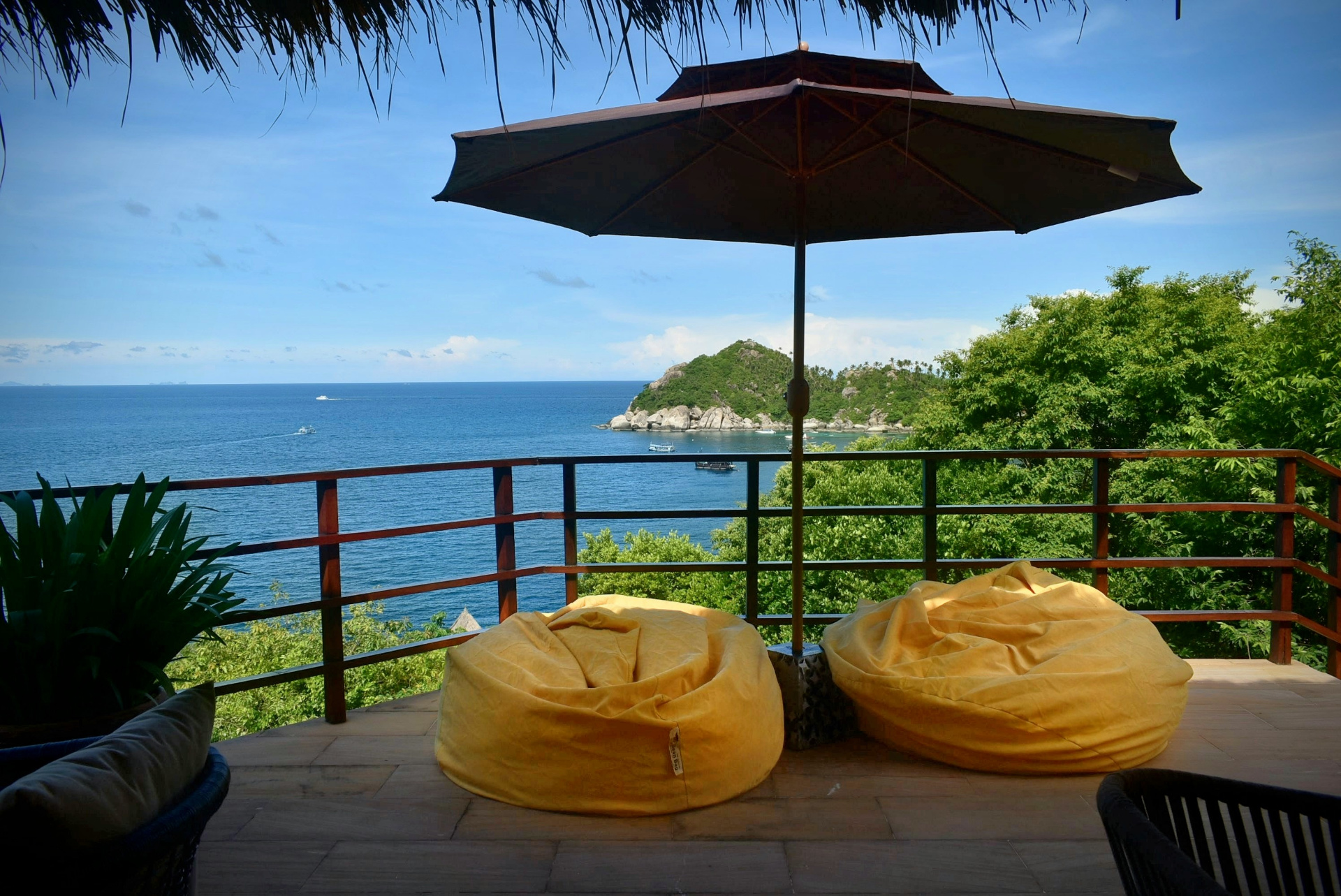 Sun terrace with bean bags and parasol overlooking Shark Bay at The Fisherman’s House