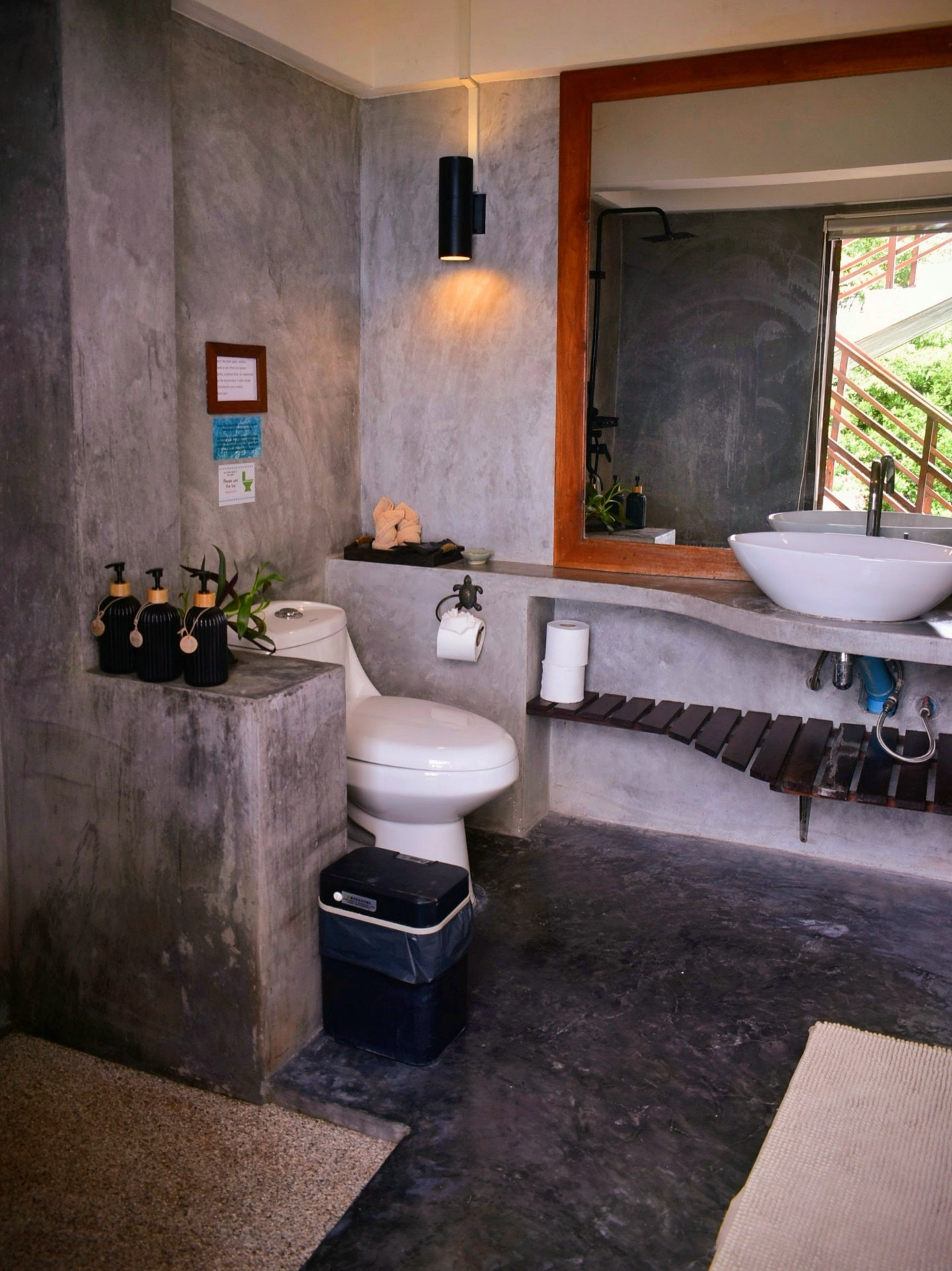 Polished concrete bathroom with vessel sink in The Fisherman’s House